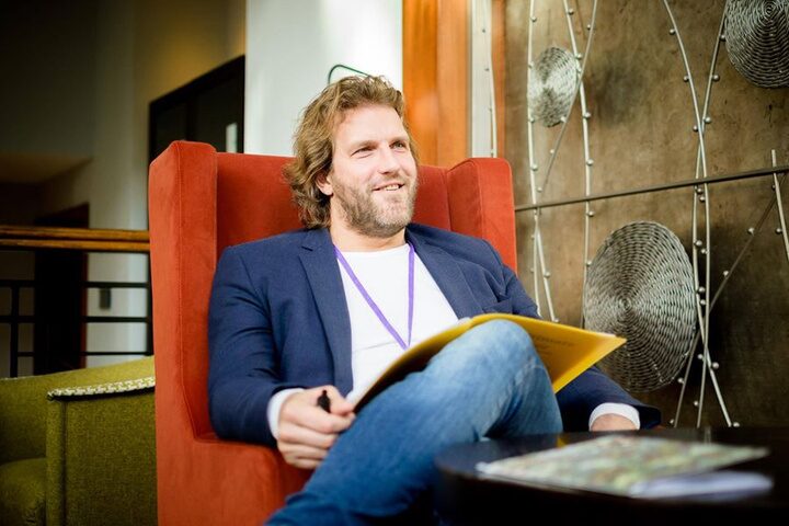 A man reflecting in an armchair